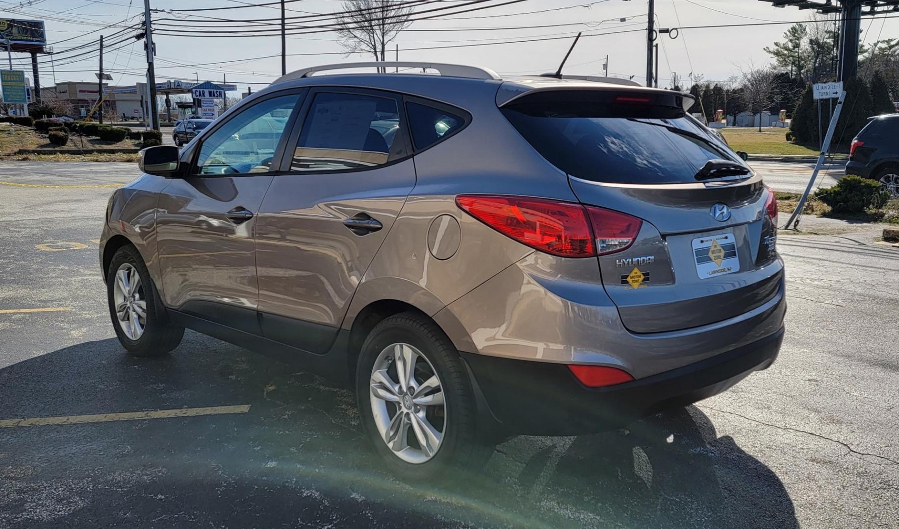 2012 Brown /Black Hyundai Tucson Limited (KM8JUCAC7CU) with an 4-Cyl, PZEV, 2.4 Liter engine, Automatic transmission, located at 341 N White Horse Pike, Lawnside, NJ, 08045, (856) 262-9500, 39.855621, -75.027451 - Photo#3